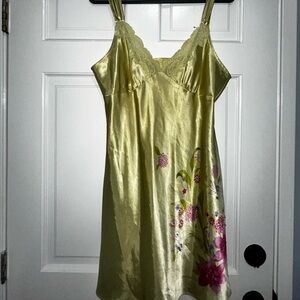 Light yellowish green slip dress with lace detailing and adjustable straps